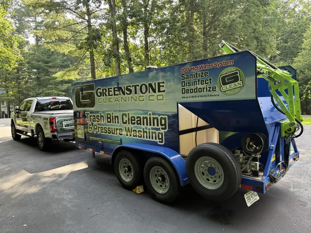 Greenstone Cleaning Co. truck and bin-cleaning trailer viewed from the side