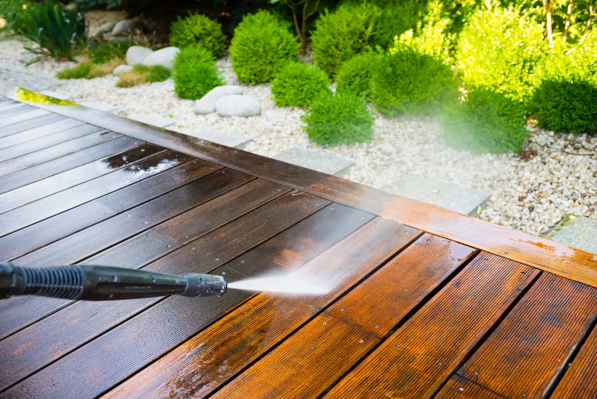 Residential exterior surface being cleaned